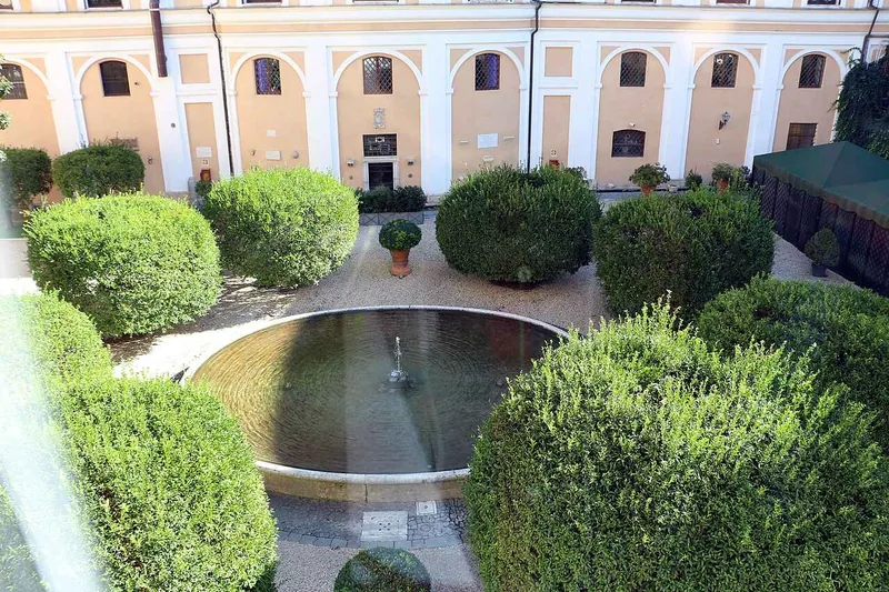 The palace garden seen from above, clipped box around a round fountain